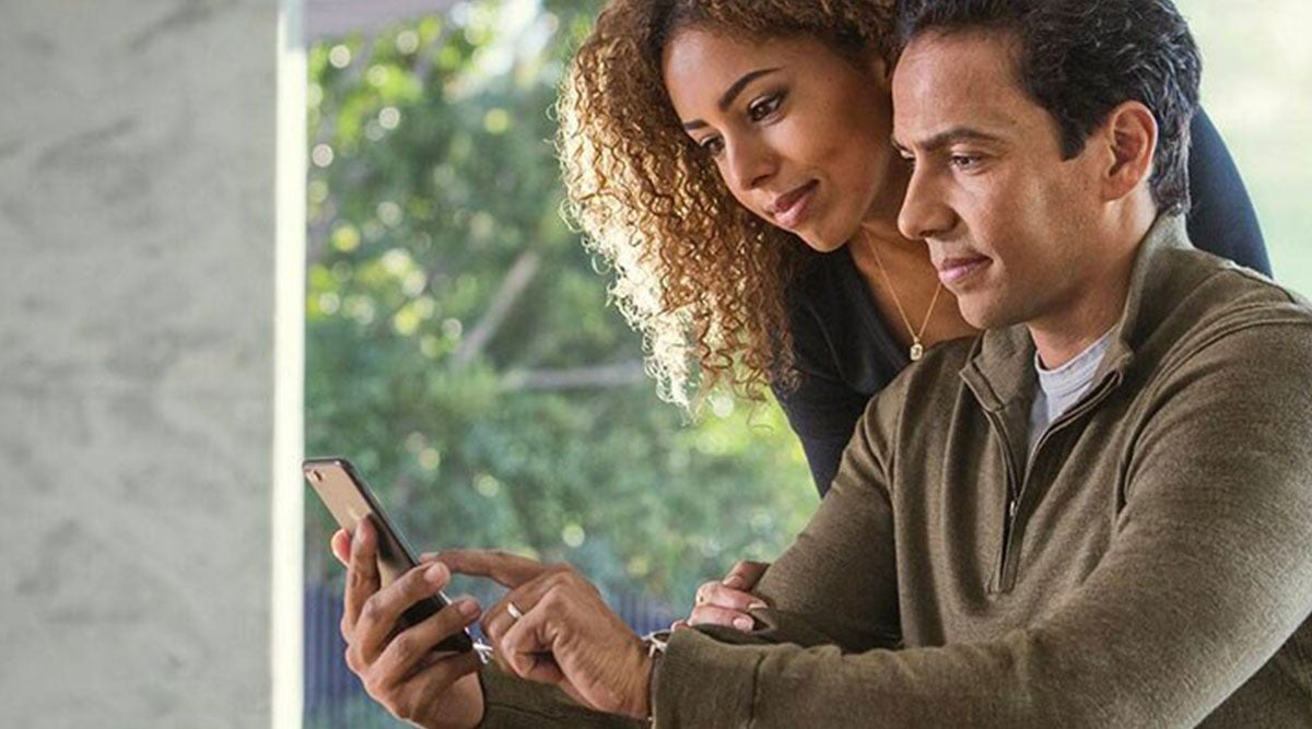 Couple looking on a mobile phone
