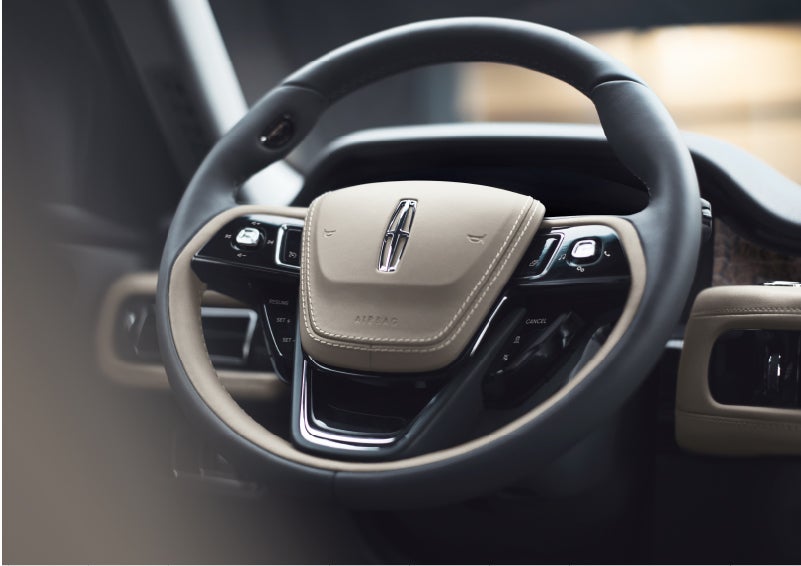 The intuitively placed controls of the steering wheel on a 2023 Lincoln Aviator® SUV | Uptown Lincoln in Wauwatosa WI