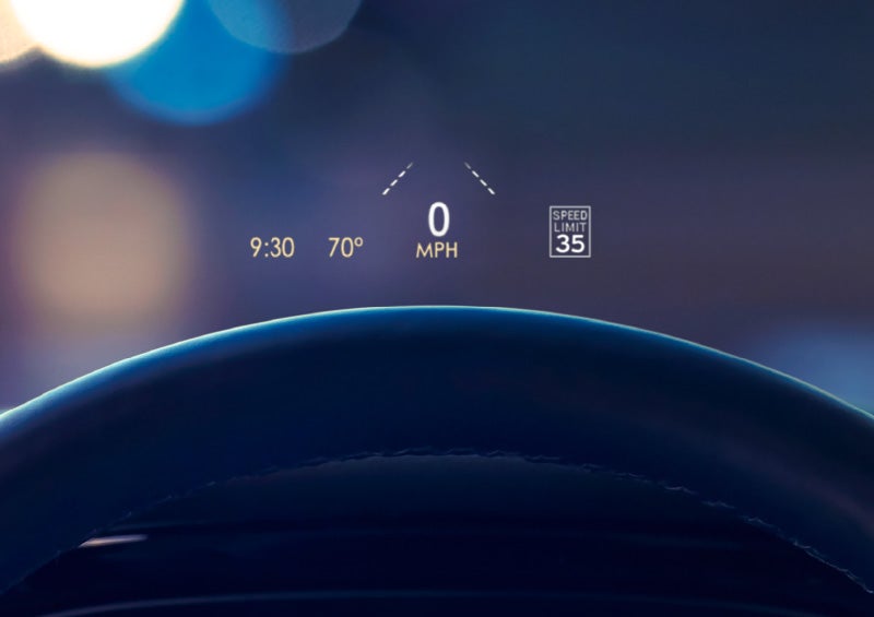 Useful driver information is being projected onto the windshield by the available Head-Up Display.
