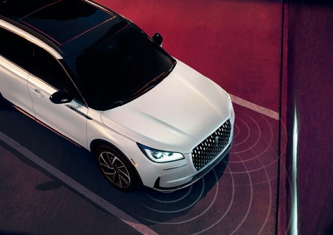 Illustrated radar signals are shown emitting from the front of a 2025 Lincoln Corsair® SUV. | Uptown Lincoln in Wauwatosa WI