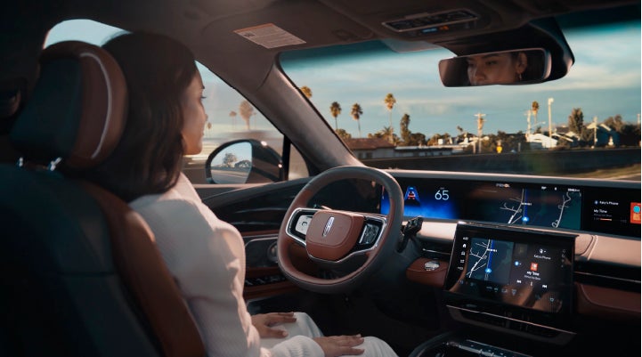 A person is shown driving hands-free on the highway with available Lincoln BlueCruise technology. | Uptown Lincoln in Wauwatosa WI