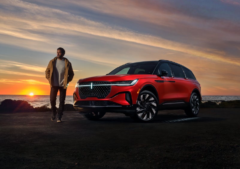 A person is shown next to a 2025 Lincoln Nautilus® SUV as the Lincoln Embrace sequence takes place. | Uptown Lincoln in Wauwatosa WI