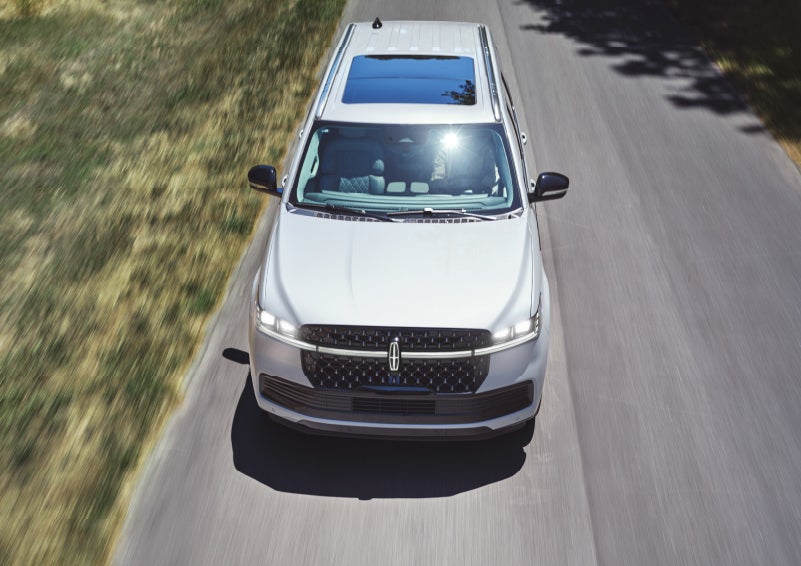The nameplate badge near the passenger sideview mirror on a 2025 Lincoln Navigator® SUV shows off geometric design.