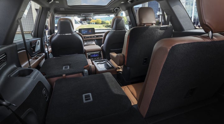 One side of the PowerFold® third-row seat and a second-row seat are folded forward in the 2026 Lincoln Aviator® SUV. | Uptown Lincoln in Wauwatosa WI
