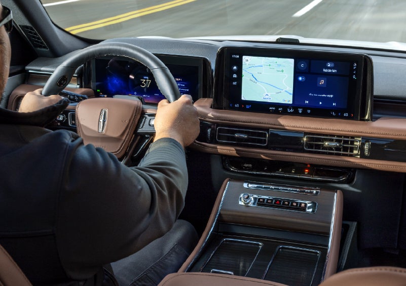 A person is driving a 2026 Lincoln Aviator® SUV as seen from inside the cabin. | Uptown Lincoln in Wauwatosa WI