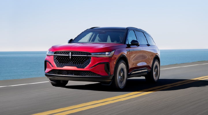 A 2026 Lincoln Nautilus® SUV is being driven on a seaside roadway. | Uptown Lincoln in Wauwatosa WI