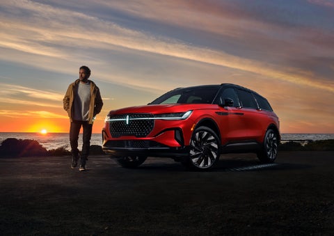 A person is shown next to a 2026 Lincoln Nautilus® SUV as the Lincoln Embrace sequence takes place. | Uptown Lincoln in Wauwatosa WI