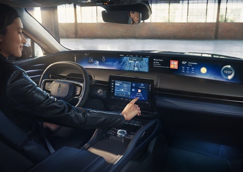 The driver of a 2026 Lincoln Nautilus® SUV interacts with the center touchscreen. | Uptown Lincoln in Wauwatosa WI