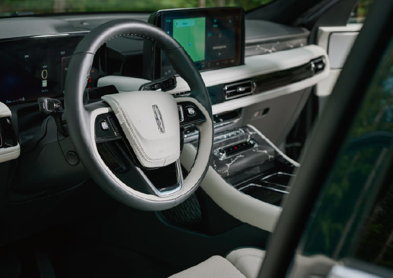 The leather-trimmed steering wheel of a 2027 Lincoln Aviator® Black Label™ SUV. | Uptown Lincoln in Wauwatosa WI