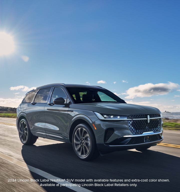 A 2024 Lincoln Nautilus® SUV is being driven on a coastal highway.